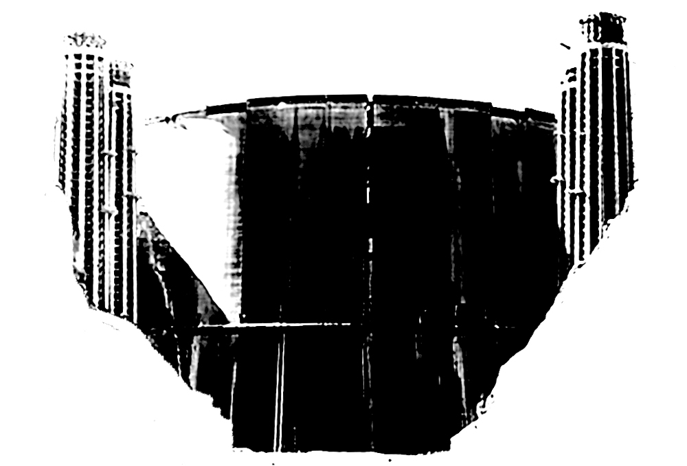 Blurry, black and white photo of a large structure with two towers connected by a large shield-like surface. If you don't recognize it, click the image to find out more!